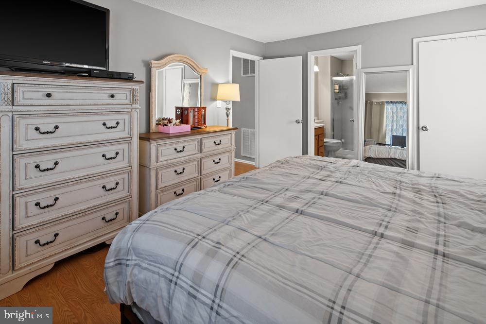 52 Willow Court Hamilton, NJ 08619 - Photo 11 of 23 a bedroom with a bed and a flat screen tv