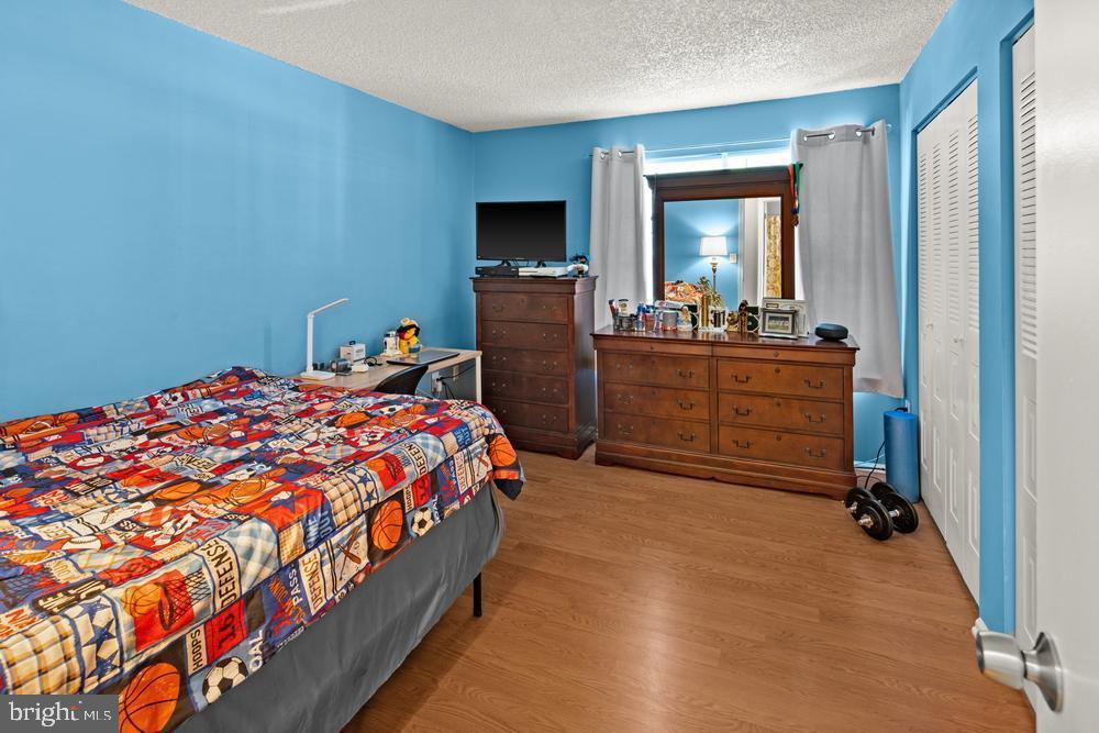 52 Willow Court Hamilton, NJ 08619 - Photo 16 of 23 a bed room with a bed and a mirror
