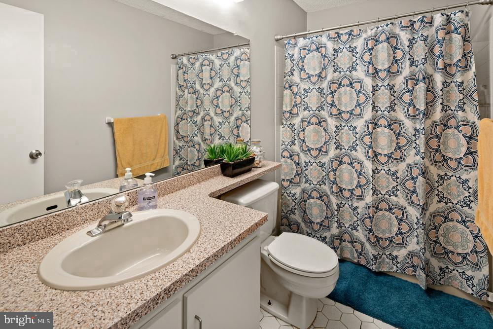 52 Willow Court Hamilton, NJ 08619 - Photo 17 of 23 a bathroom with a granite countertop sink and a mirror