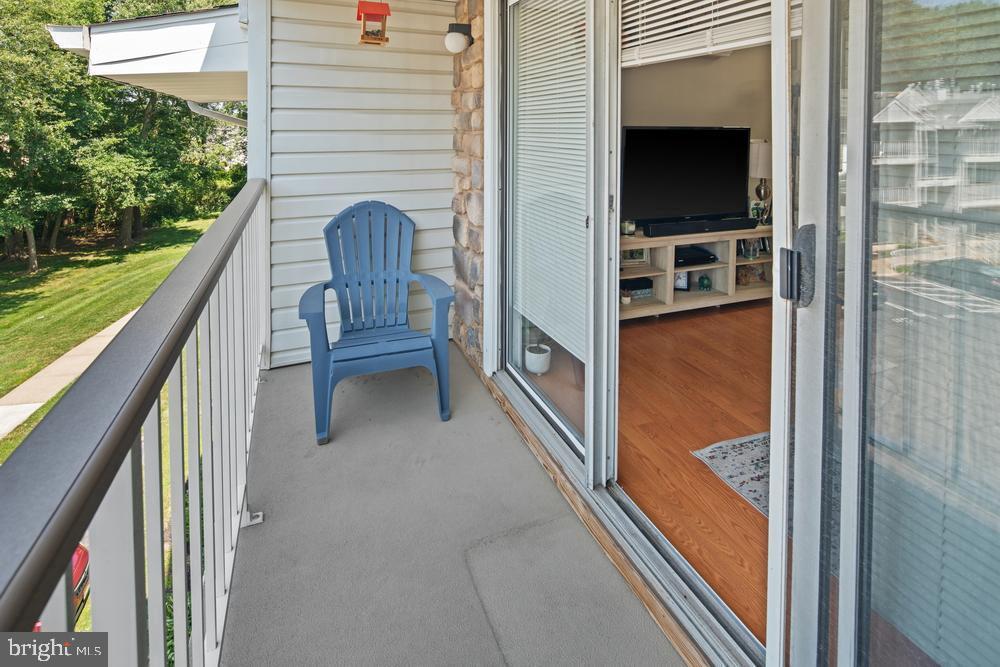 52 Willow Court Hamilton, NJ 08619 - Photo 19 of 23 a balcony with table and chairs