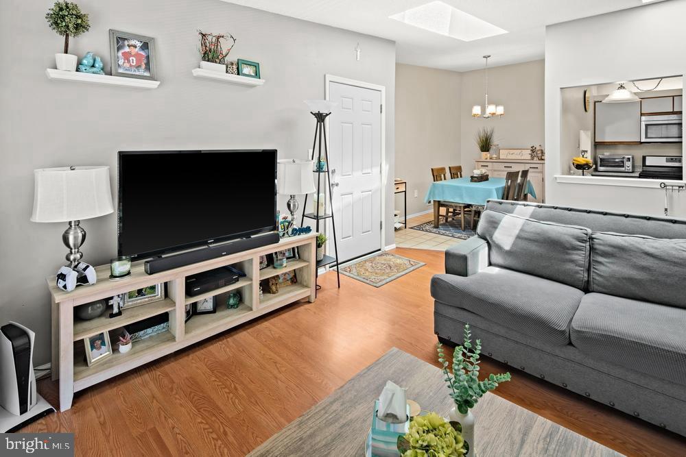 52 Willow Court Hamilton, NJ 08619 - Photo 3 of 23 a living room with furniture and a flat screen tv