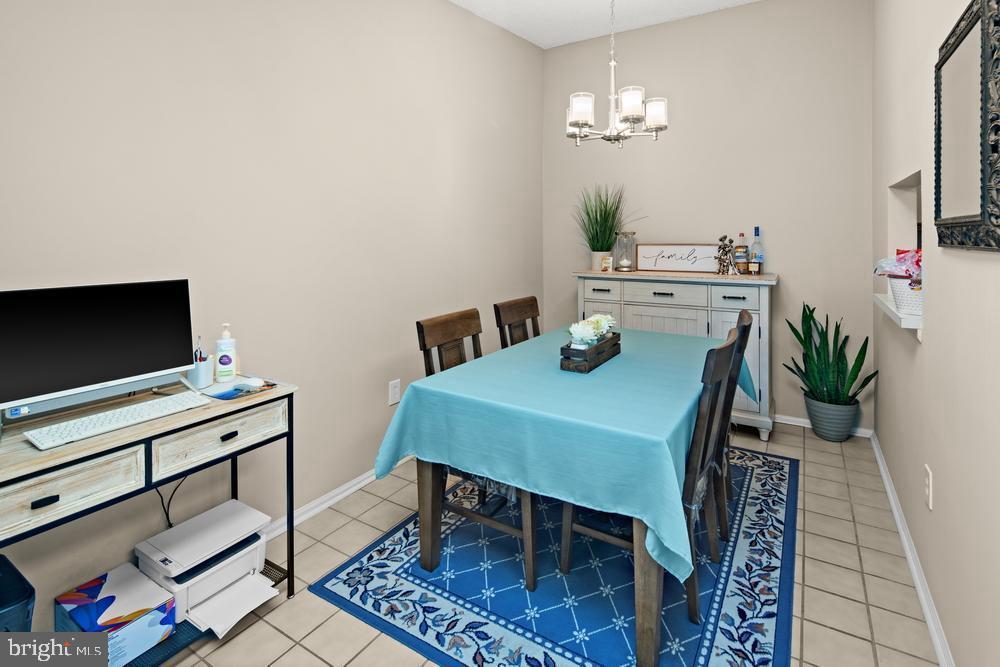 52 Willow Court Hamilton, NJ 08619 - Photo 10 of 23 a view of a dining room with furniture and a chandelier