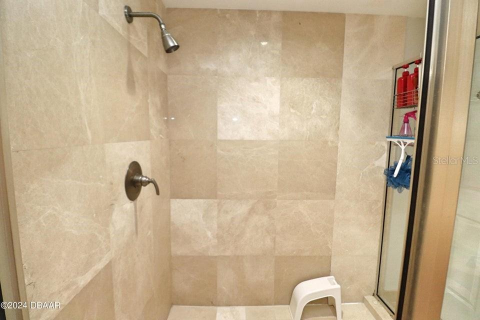 231 Riverside Drive, Unit 11061 Daytona Beach, FL 32117 - Photo 14 of 45 a bathroom with a shower