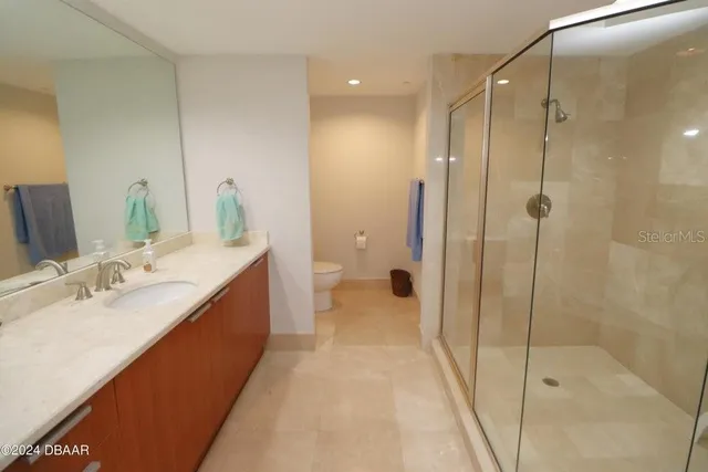 a bathroom with a tub sink and shower