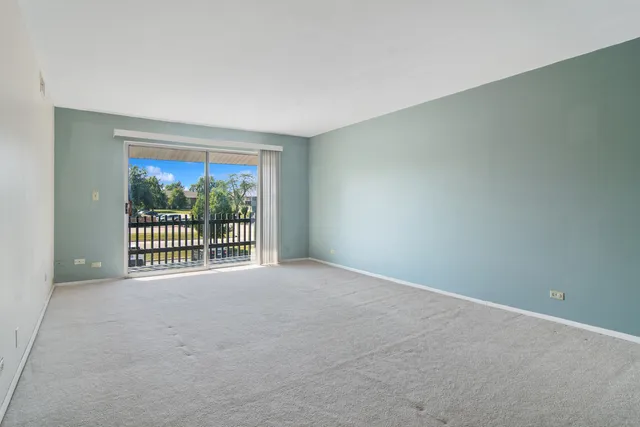 a view of a room with a large window