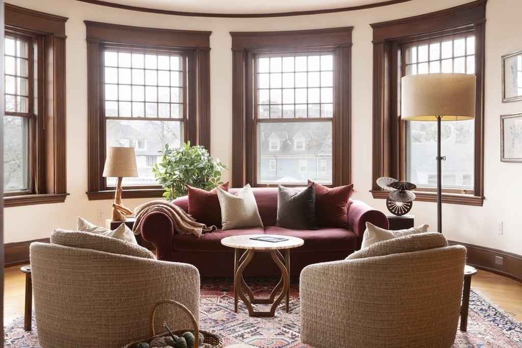 367 Harvard Street, Unit 3 Brookline, MA 02446 - Photo 2 of 25 a living room with furniture and a large window