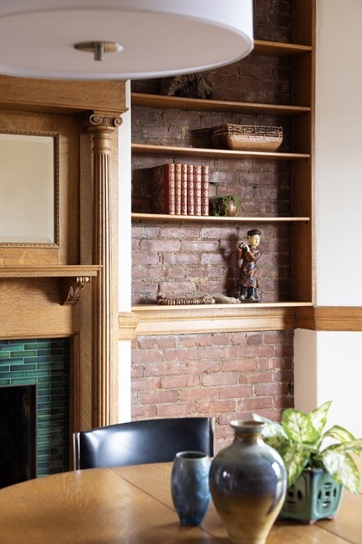 367 Harvard Street, Unit 3 Brookline, MA 02446 - Photo 8 of 25 a kitchen with a potted plant on the counter and a window