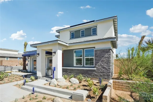 a front view of a house with patio