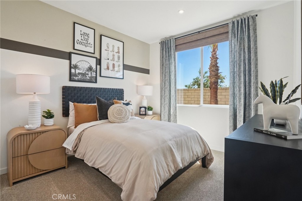 73634 Raphael Drive Palm Desert, CA 92211 - Photo 18 of 24 a bedroom with a large bed and a window