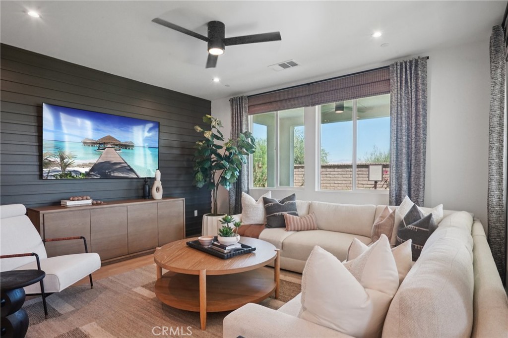 73634 Raphael Drive Palm Desert, CA 92211 - Photo 2 of 24 a living room with furniture and a large window
