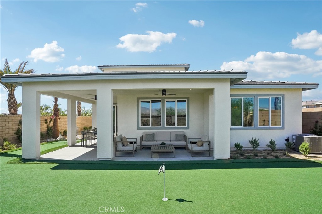 73634 Raphael Drive Palm Desert, CA 92211 - Photo 23 of 24 a front view of a house with garden