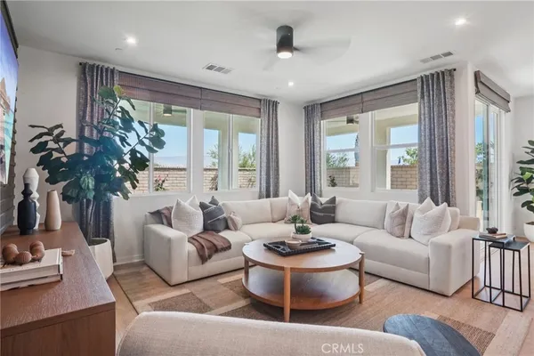 a living room with furniture and a large window