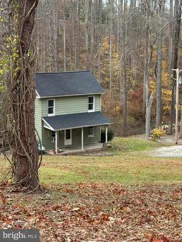 a house view with a backyard space