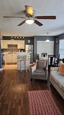 a living room with furniture and a rug