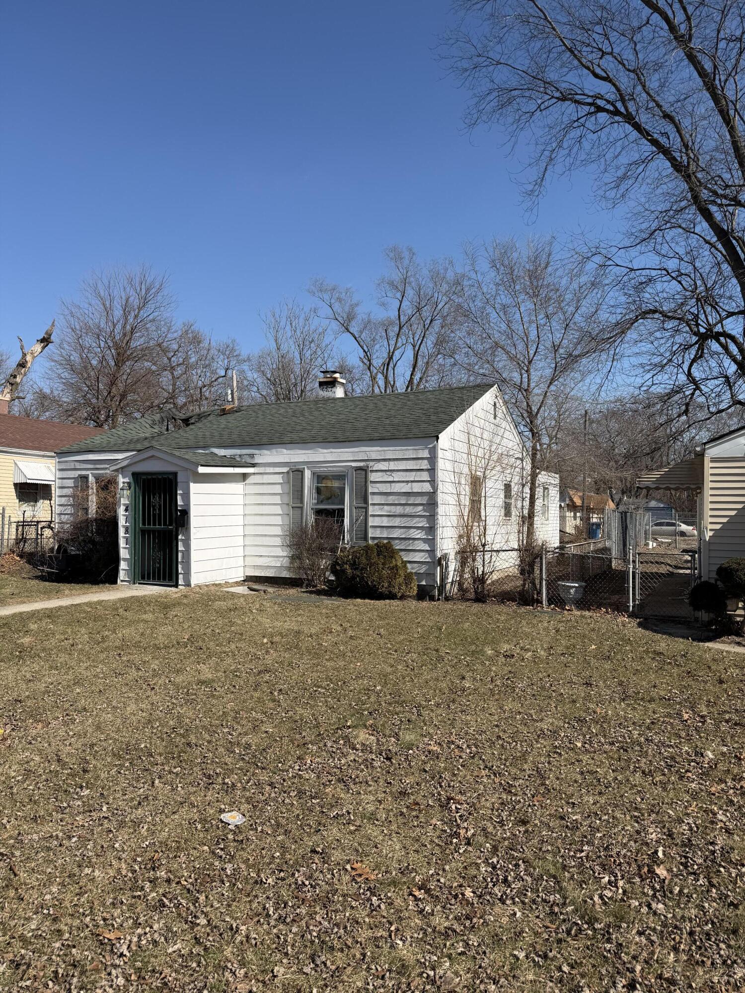 4181 Fillmore Street Gary, IN 46408 - Photo 2 of 4 a view of a house with a yard and garage