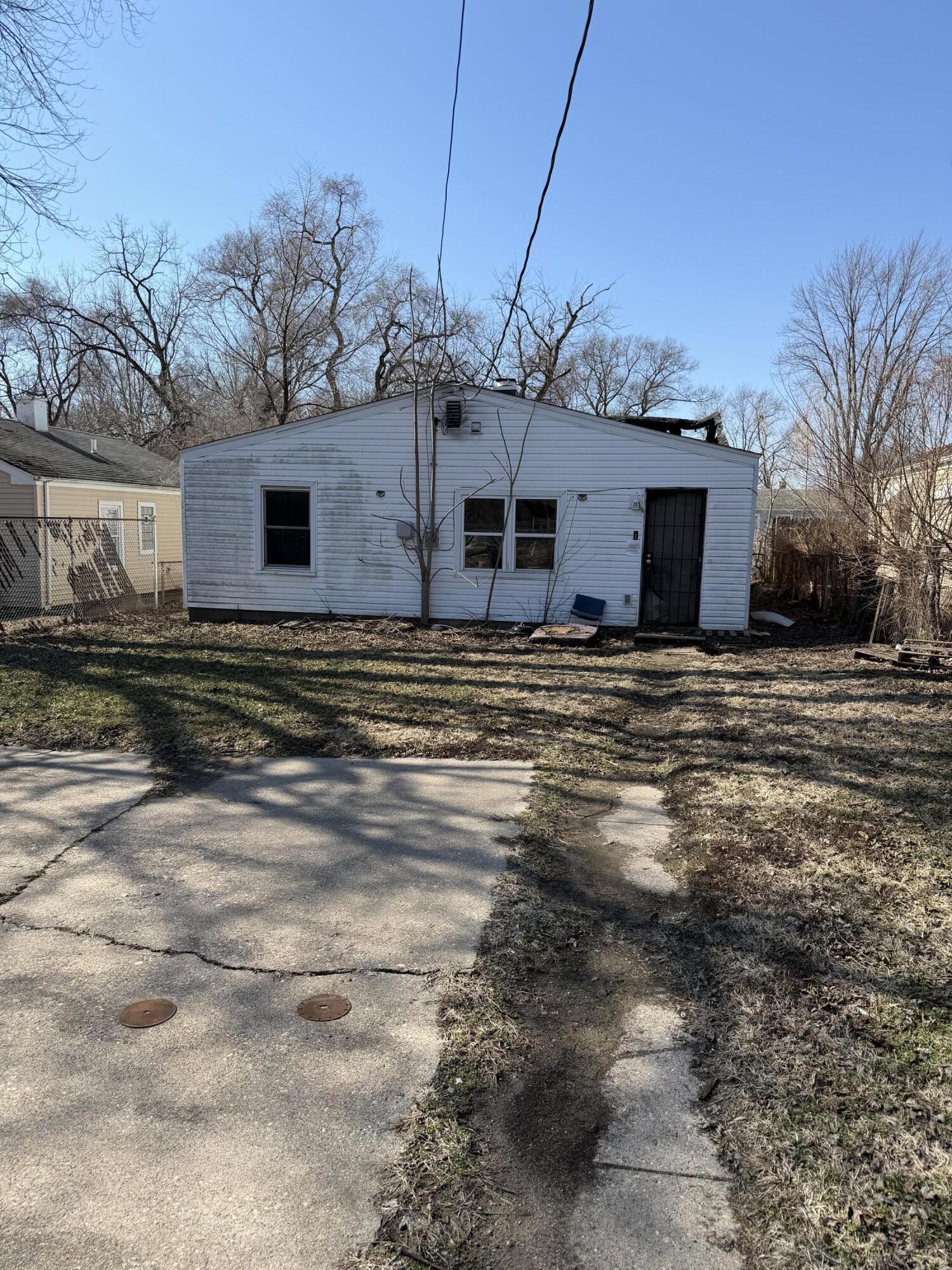 4181 Fillmore Street Gary, IN 46408 - Photo 4 of 4 a view of a house with a snow in the yard