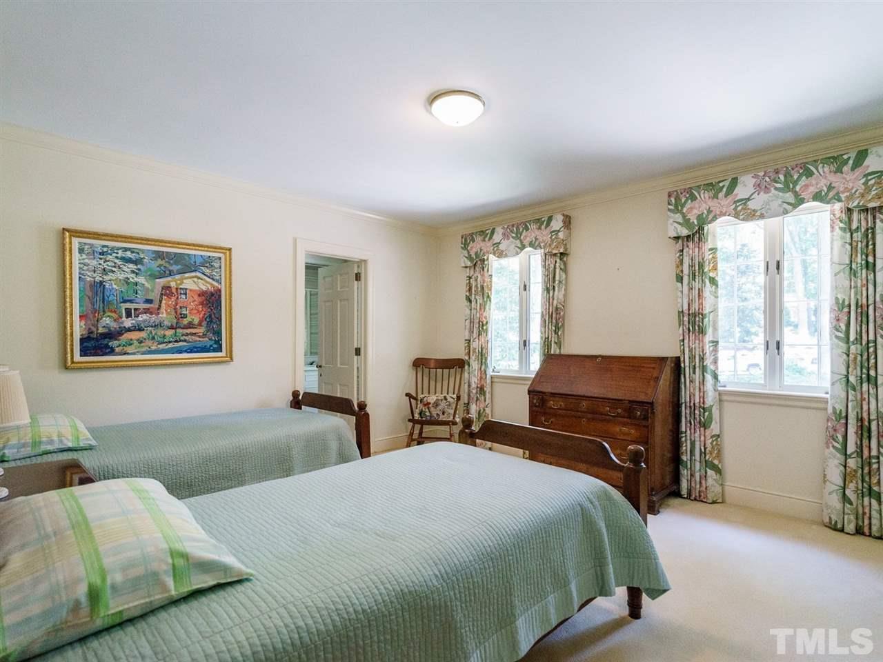 1001 Marlowe Road Raleigh, NC 27609 - Photo 14 of 25 a bedroom with a bed and a couch