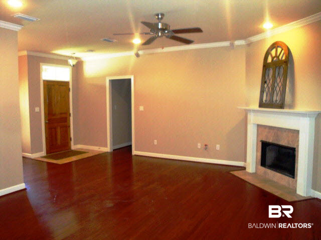 9345 Collier Loop Daphne, AL 36526 - Photo 3 of 14 HARDWOOD FLOORS IN LIVING, DINING AND HALLWAY.