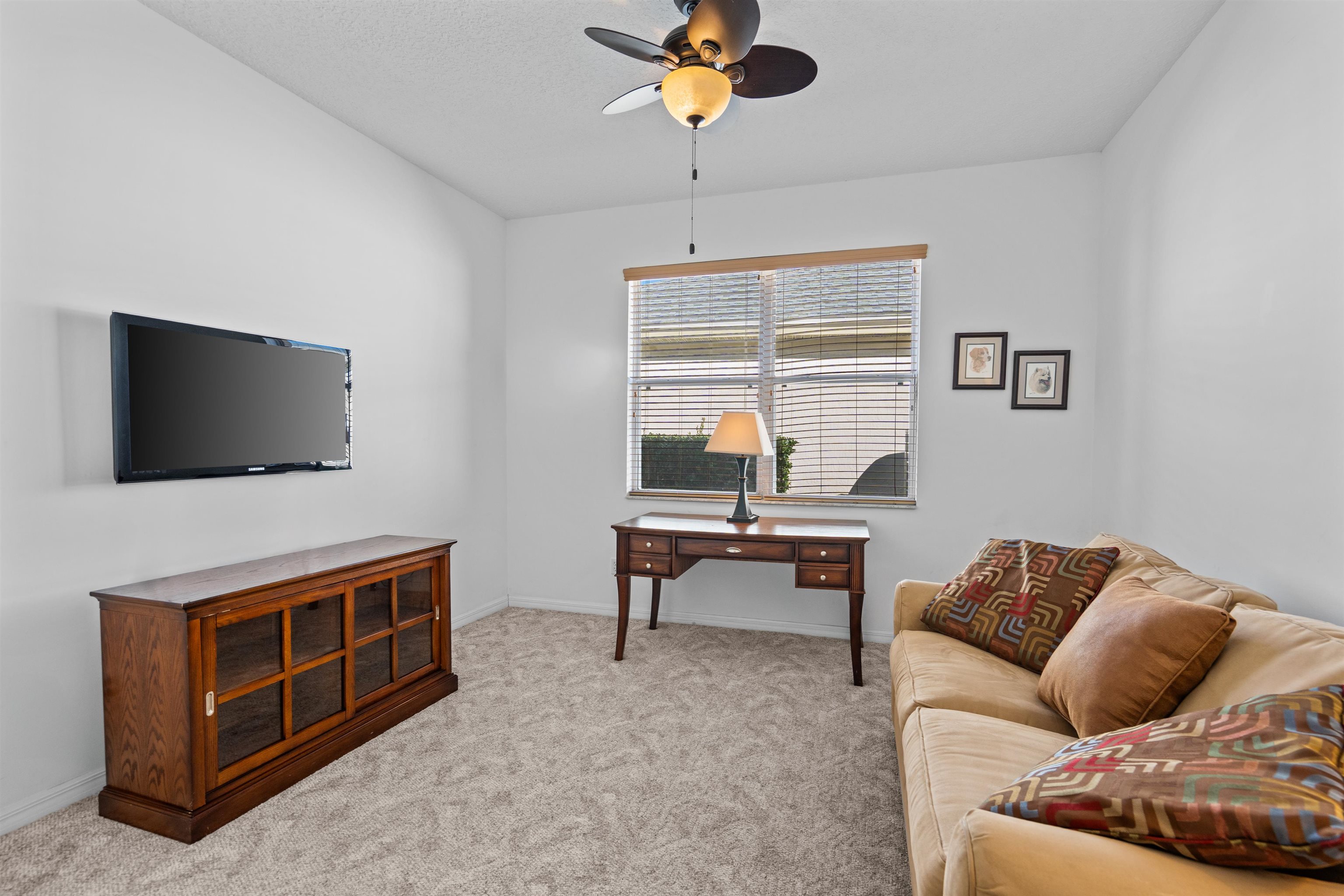 660 Casa Fuerta Lane St. Augustine, FL 32080 - Photo 17 of 52 Living area with light carpet and a ceiling fan