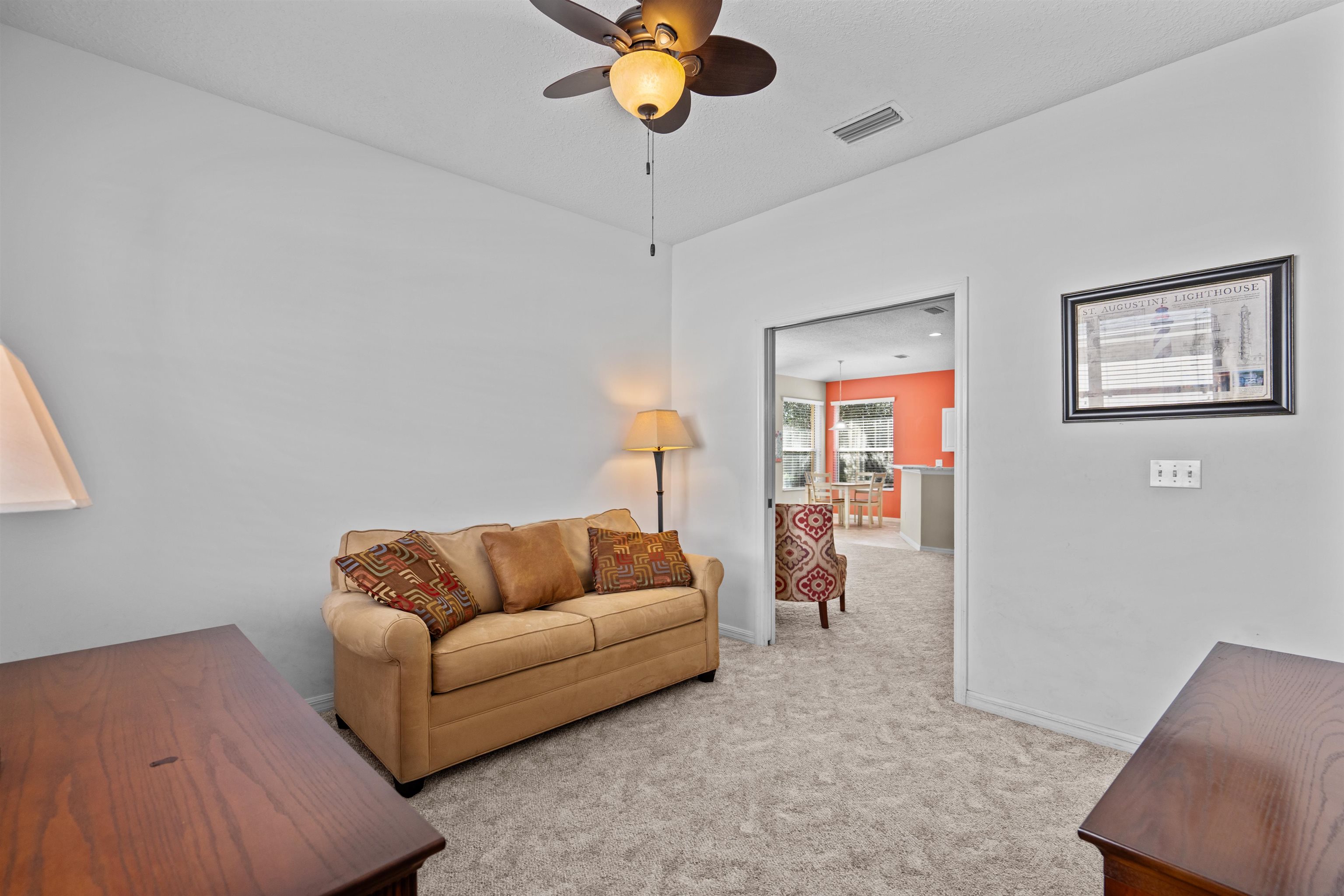 660 Casa Fuerta Lane St. Augustine, FL 32080 - Photo 18 of 52 a living room with furniture and a potted plant