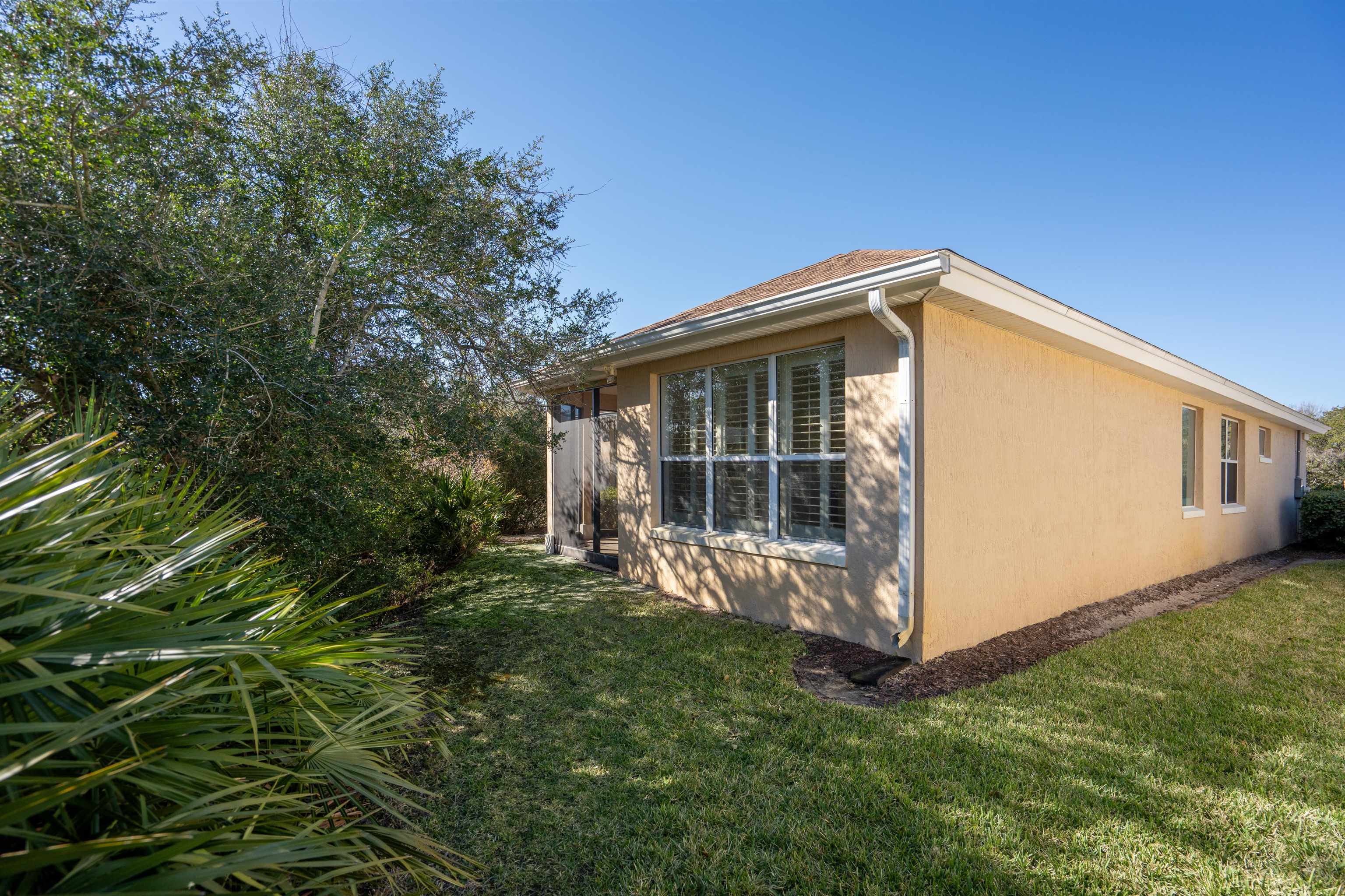 660 Casa Fuerta Lane St. Augustine, FL 32080 - Photo 25 of 52 a view of a house with a yard