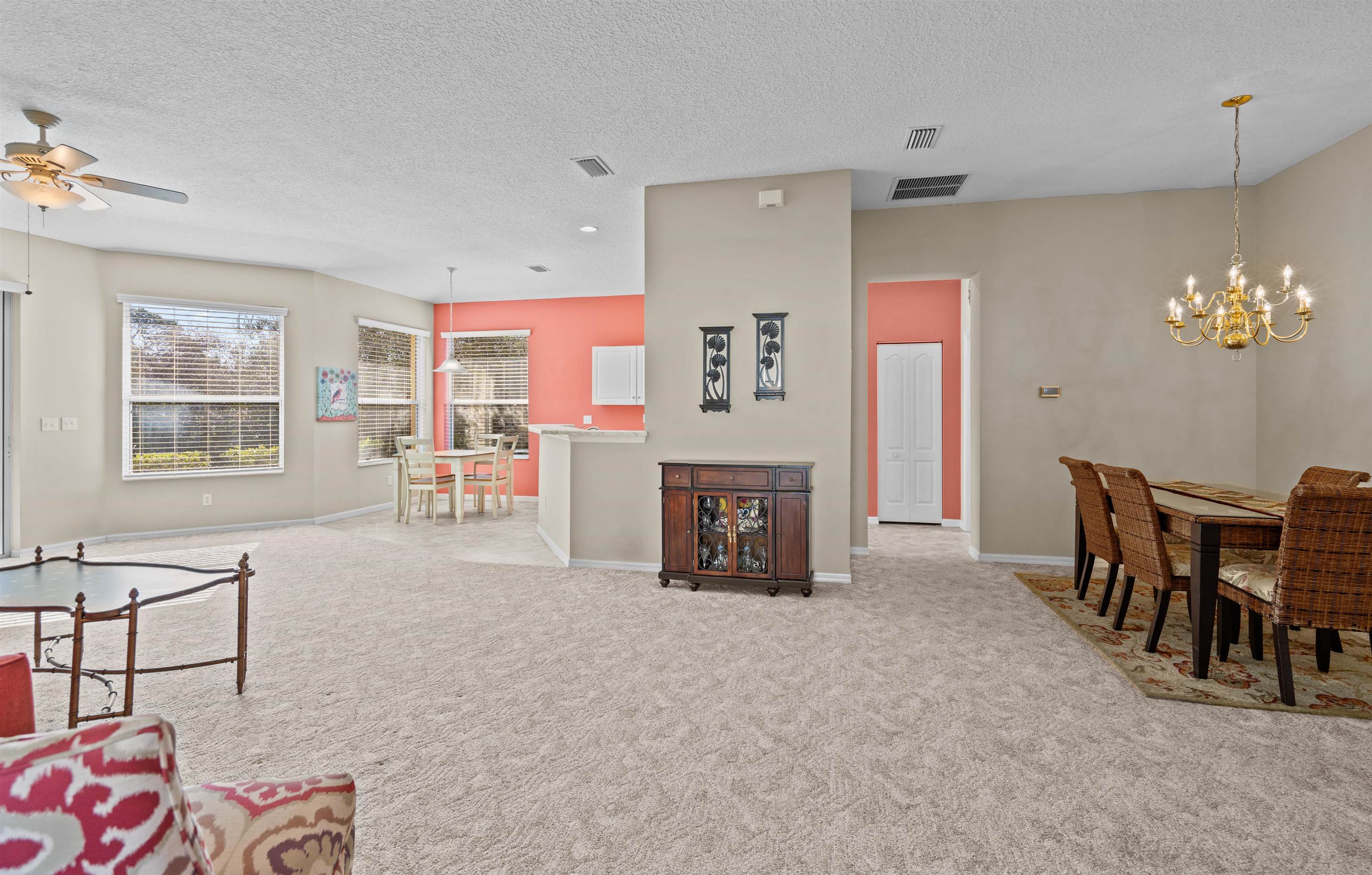 660 Casa Fuerta Lane St. Augustine, FL 32080 - Photo 7 of 52 a living room with furniture a fireplace and a table