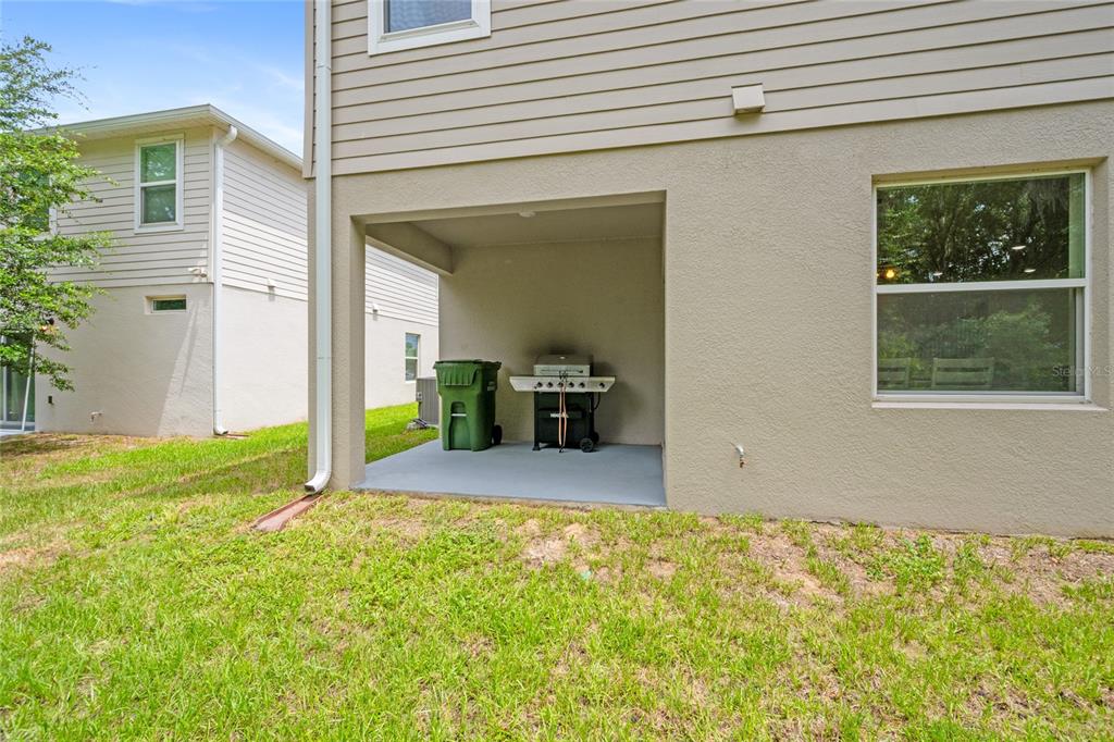 1137 Bradford Rdg Drive Leesburg, FL 34748 - Photo 31 of 37 a view of an house with backyard space and balcony