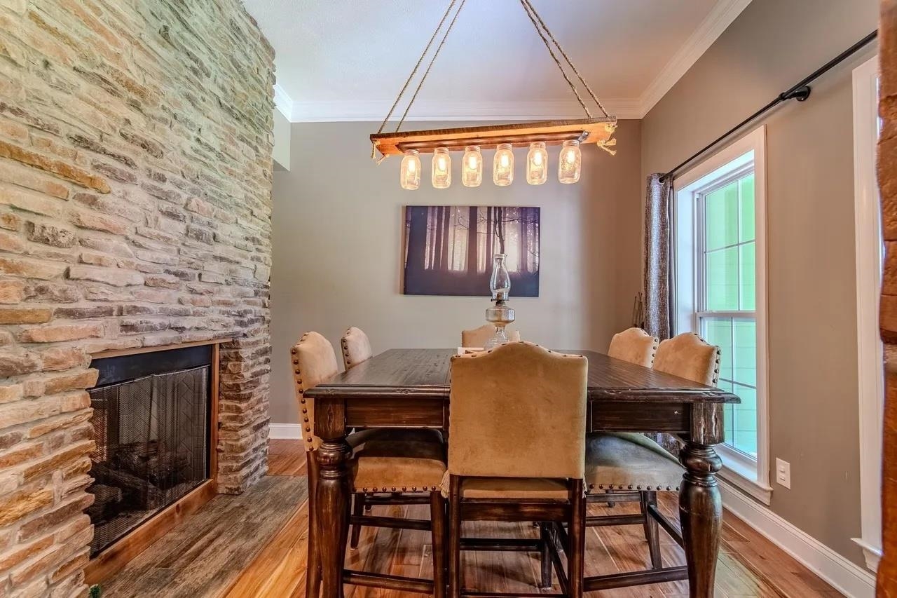 2134 Otis Plunk Road Bethel Springs, TN 38315 - Photo 10 of 35 a view of a dining room with furniture and chandelier