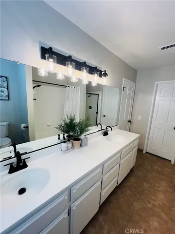 a bathroom with a sink and mirror