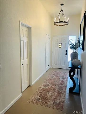 a view of a livingroom with furniture and a chandelier