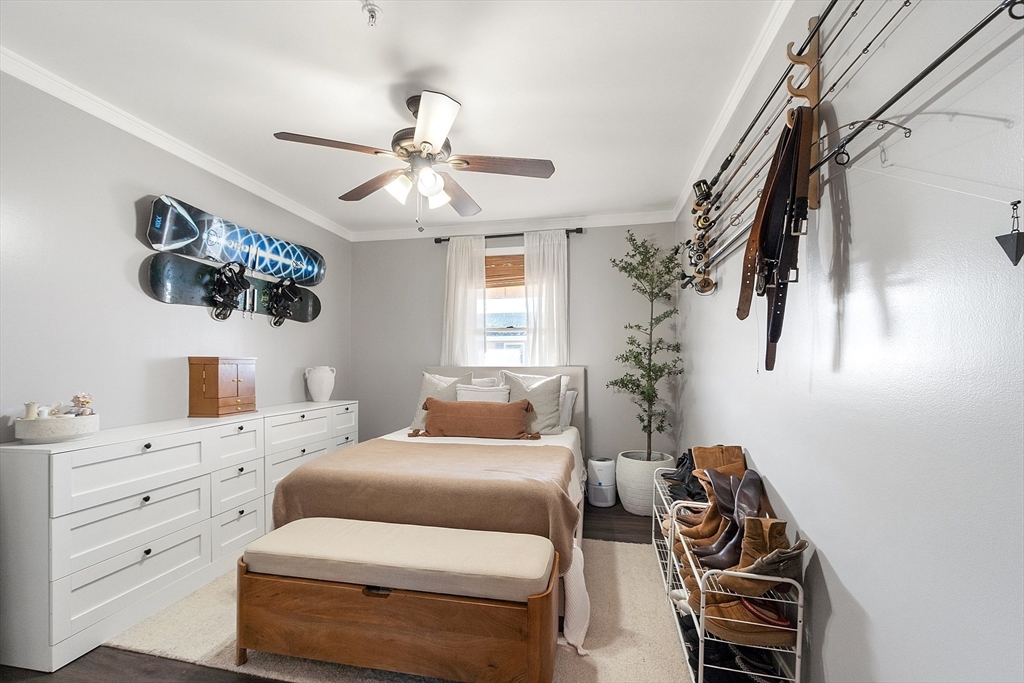 20 Cable Avenue, Unit 5 Salisbury, MA 01952 - Photo 11 of 23 a bedroom with a bed and a chandelier