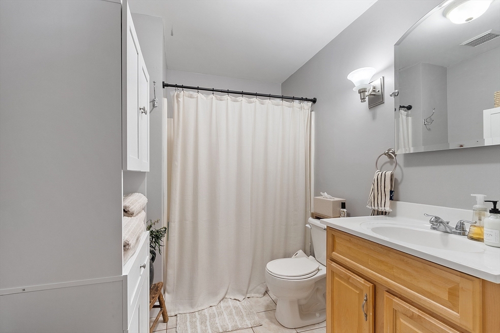 20 Cable Avenue, Unit 5 Salisbury, MA 01952 - Photo 13 of 23 a bathroom with a sink a toilet and shower