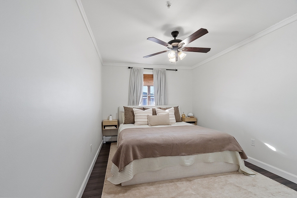 20 Cable Avenue, Unit 5 Salisbury, MA 01952 - Photo 15 of 23 a bedroom with a bed and a ceiling fan