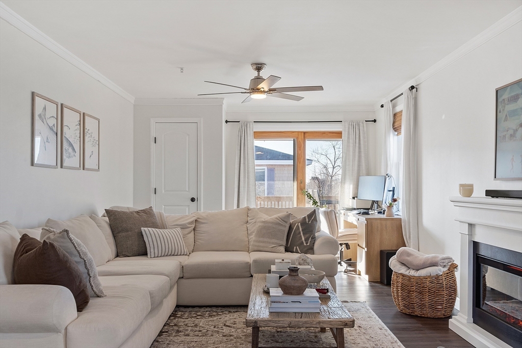 20 Cable Avenue, Unit 5 Salisbury, MA 01952 - Photo 5 of 23 a living room with furniture a fireplace and a large window