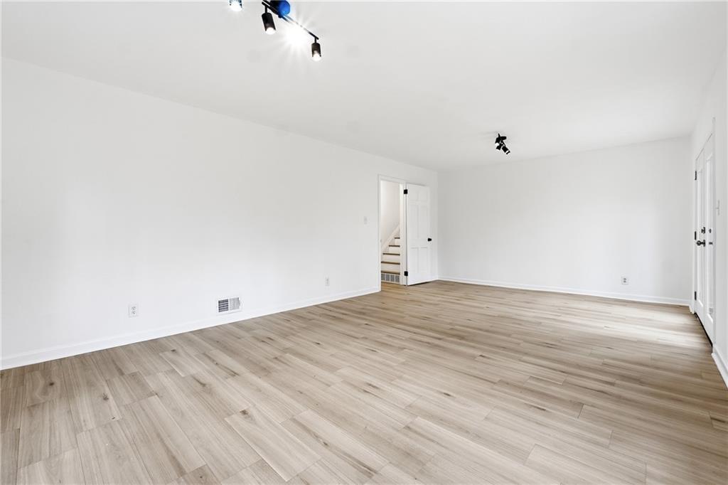 2520 Overlook Way Northeast Atlanta, GA 30345 - Photo 28 of 31 an empty room with wooden floor and windows