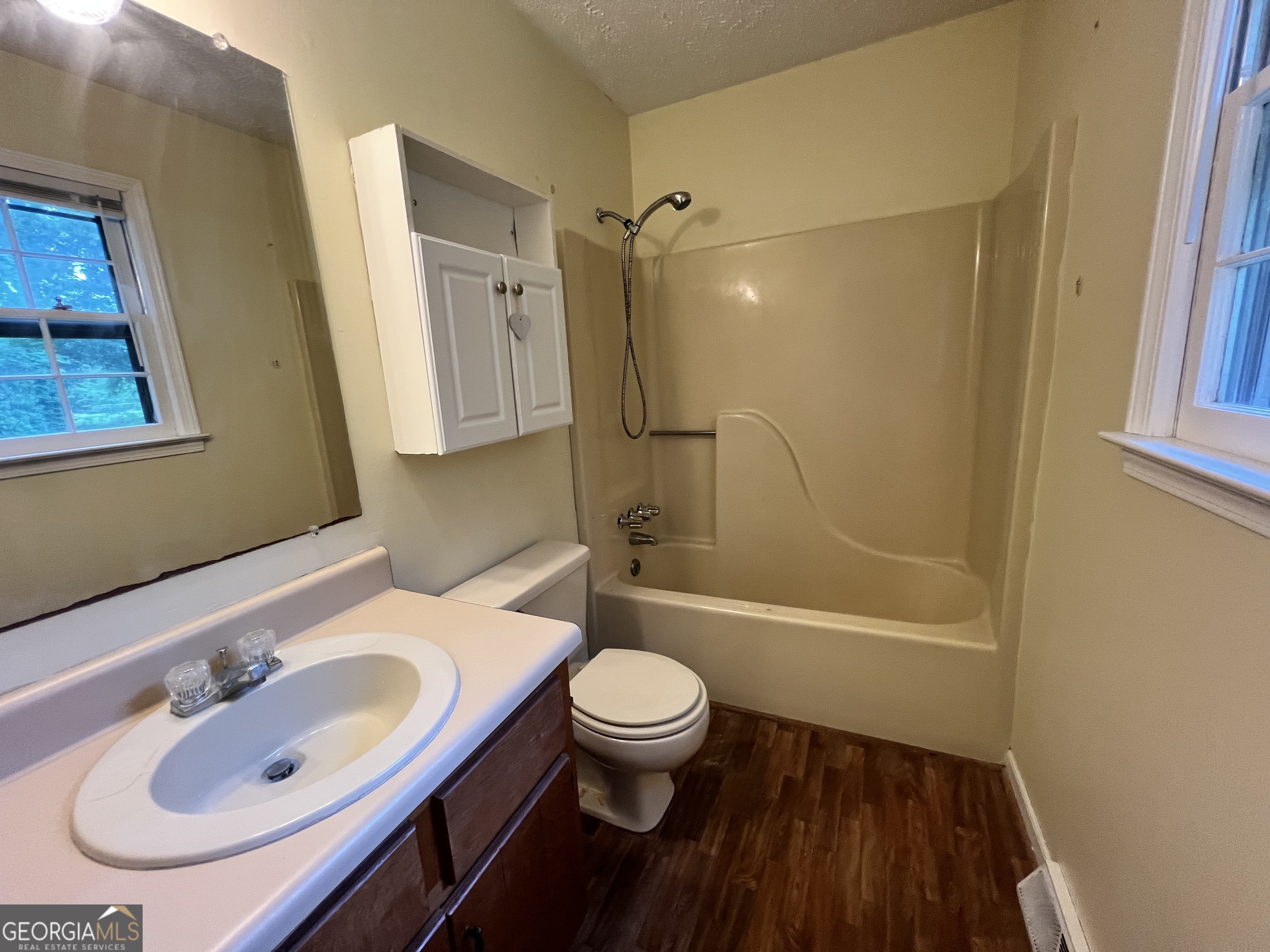 32 Ford Drive Southeast Rome, GA 30161 - Photo 17 of 49 a bathroom with a sink a toilet and a mirror