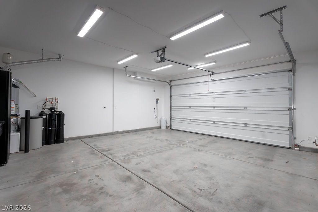 7126 Calvert Cliffs Street North Las Vegas, NV 89084 - Photo 14 of 44 Secure parking and ample storage space are provided in this bright, well-appointed garage.