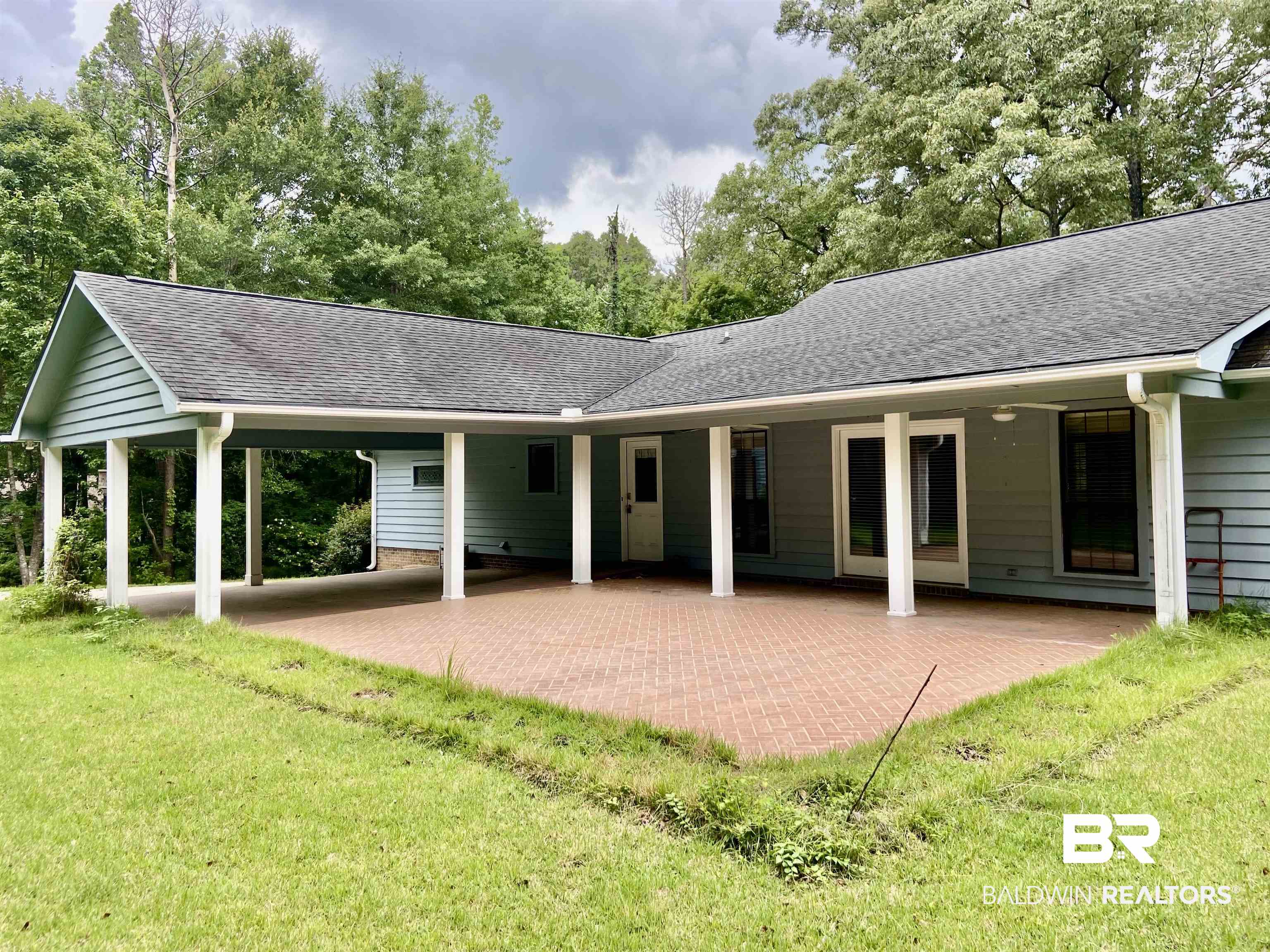 160 Mockingbird Lane Monroeville, AL 36460 - Photo 34 of 36 Back of house with a lawn and a shingled roof