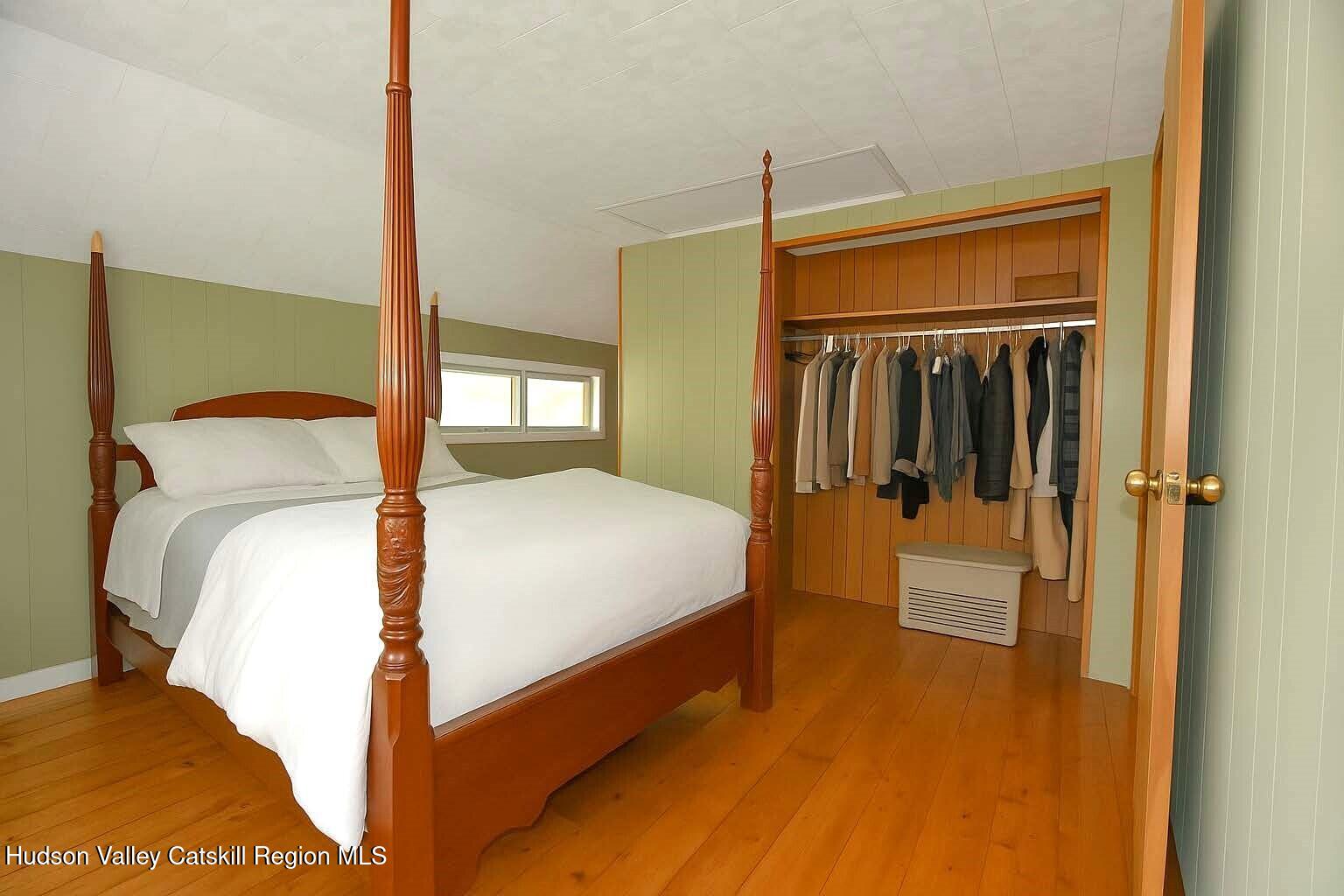 531 Old Post Road New Paltz, NY 12561 - Photo 14 of 25 a bedroom with a bed and a mirror