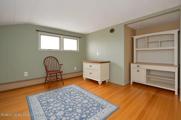 a living room with furniture and a rug