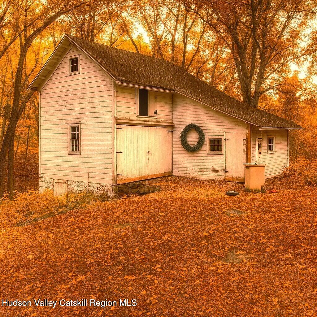 531 Old Post Road New Paltz, NY 12561 - Photo 24 of 25 a front view of a house with a yard and garage