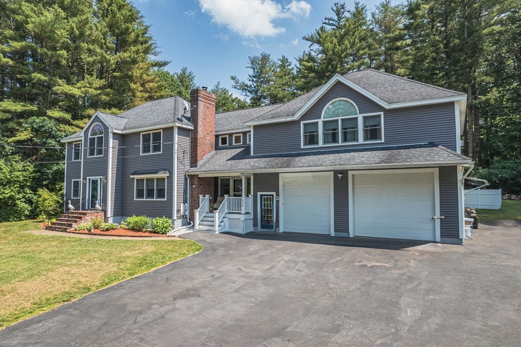 200 Boxford Road Rowley, MA 01969 - Photo 2 of 3 a front view of a house with a yard