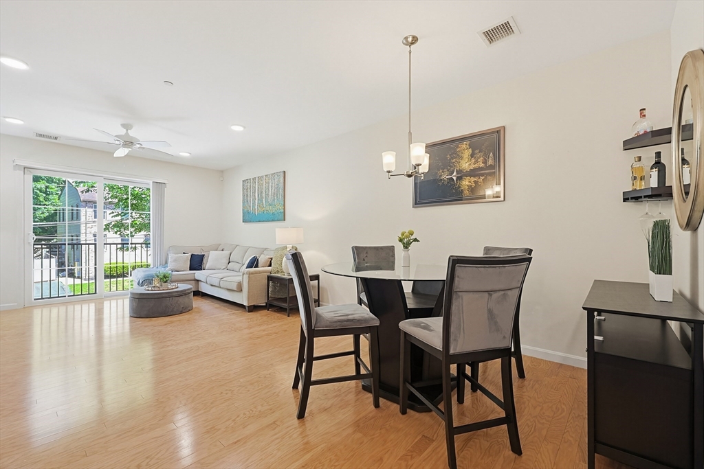 200 Revere Street, Unit 4209 Canton, MA 02021 - Photo 7 of 35 a view of a livingroom with furniture and floor to ceiling window