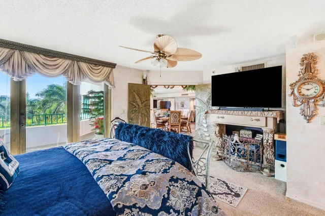 a living room with fireplace furniture and a flat screen tv