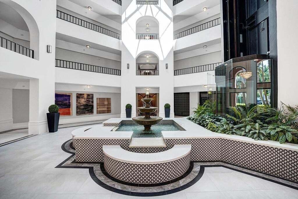 100 Southeast 5th Avenue, Unit PH14 Boca Raton, FL 33432 - Photo 25 of 49 a view of a house with couches chairs and a fire pit