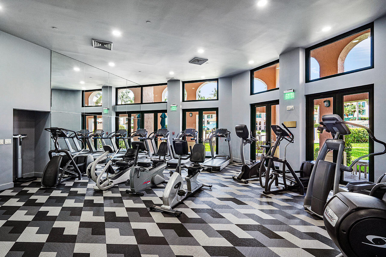 100 Southeast 5th Avenue, Unit PH14 Boca Raton, FL 33432 - Photo 36 of 49 a room with lots of windows and musical instruments