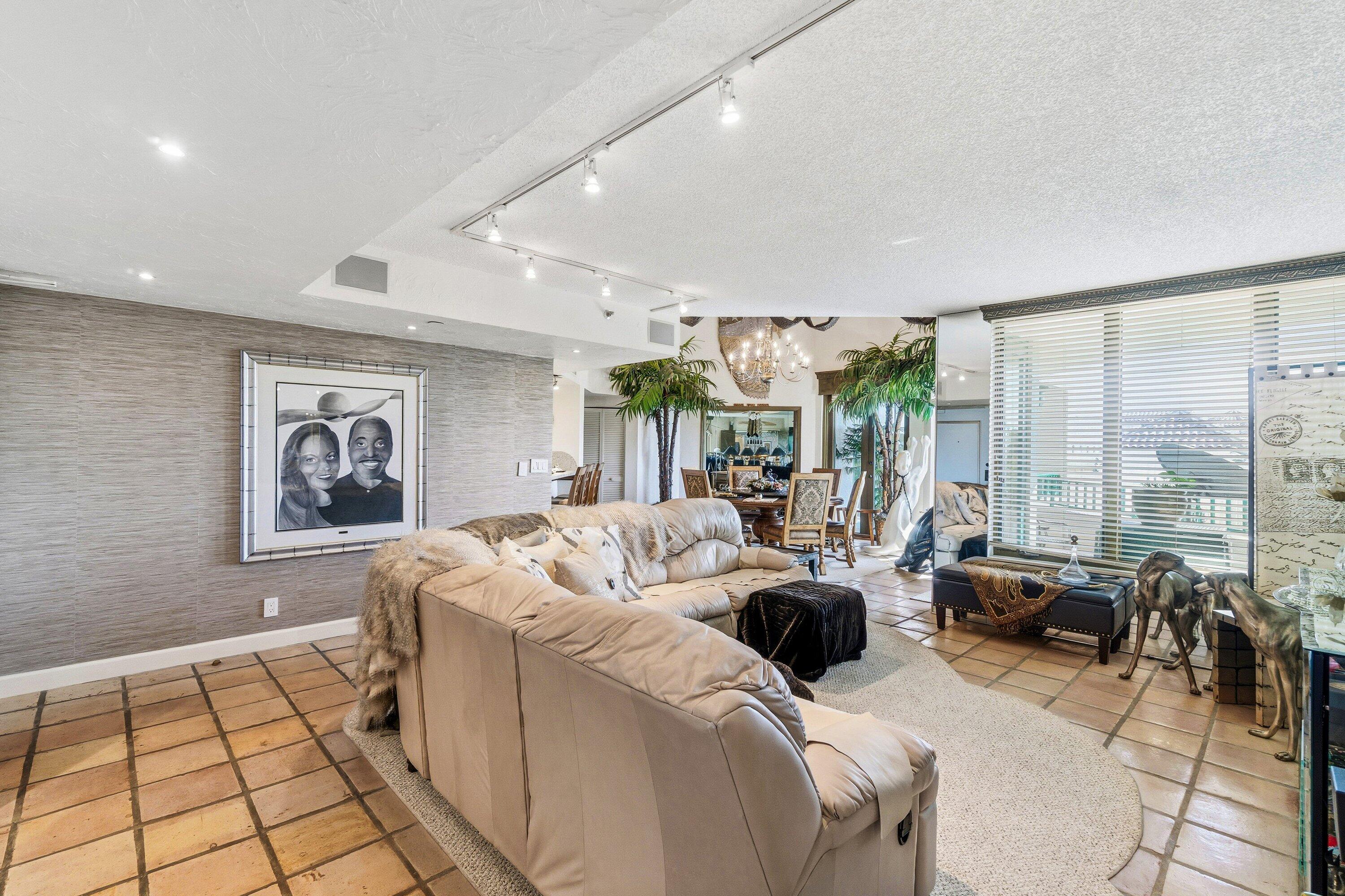 100 Southeast 5th Avenue, Unit PH14 Boca Raton, FL 33432 - Photo 4 of 49 a living room with furniture and large windows