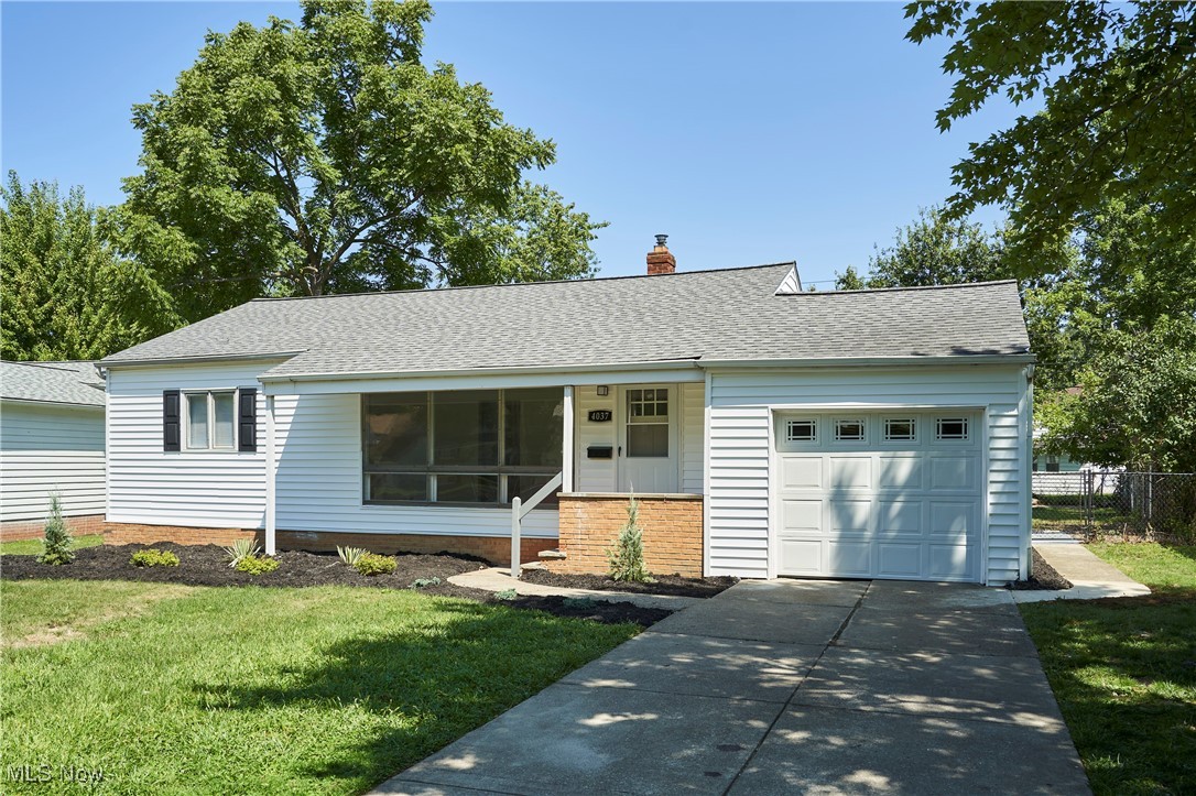 4037 Suffolk Road Cleveland, OH 44121 - Photo 26 of 26 Ranch-style home with a garage and a front lawn