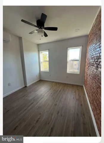 a view of an empty room and a window