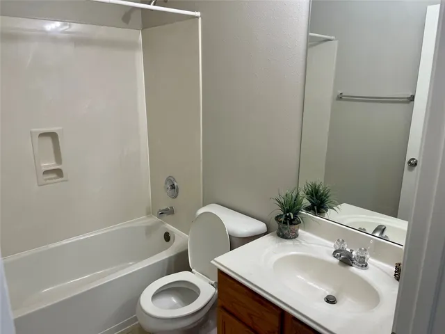 a bathroom with a sink toilet and a bathtub